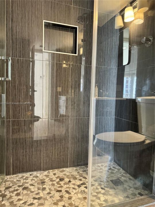 2nd bathroom shower with seamless glass doors