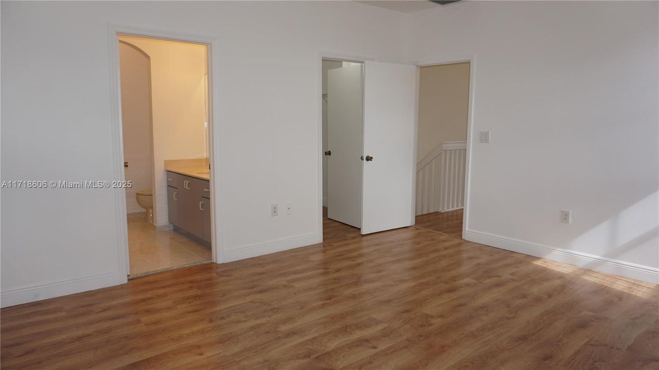 Master bedroom locate next to the stairs.