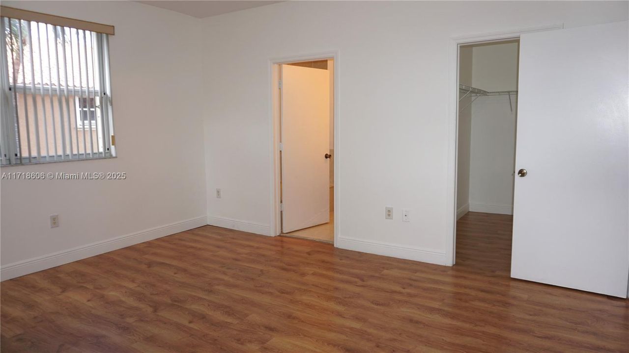 Master bedroom with access to the master Bathroom and walk-in closet.