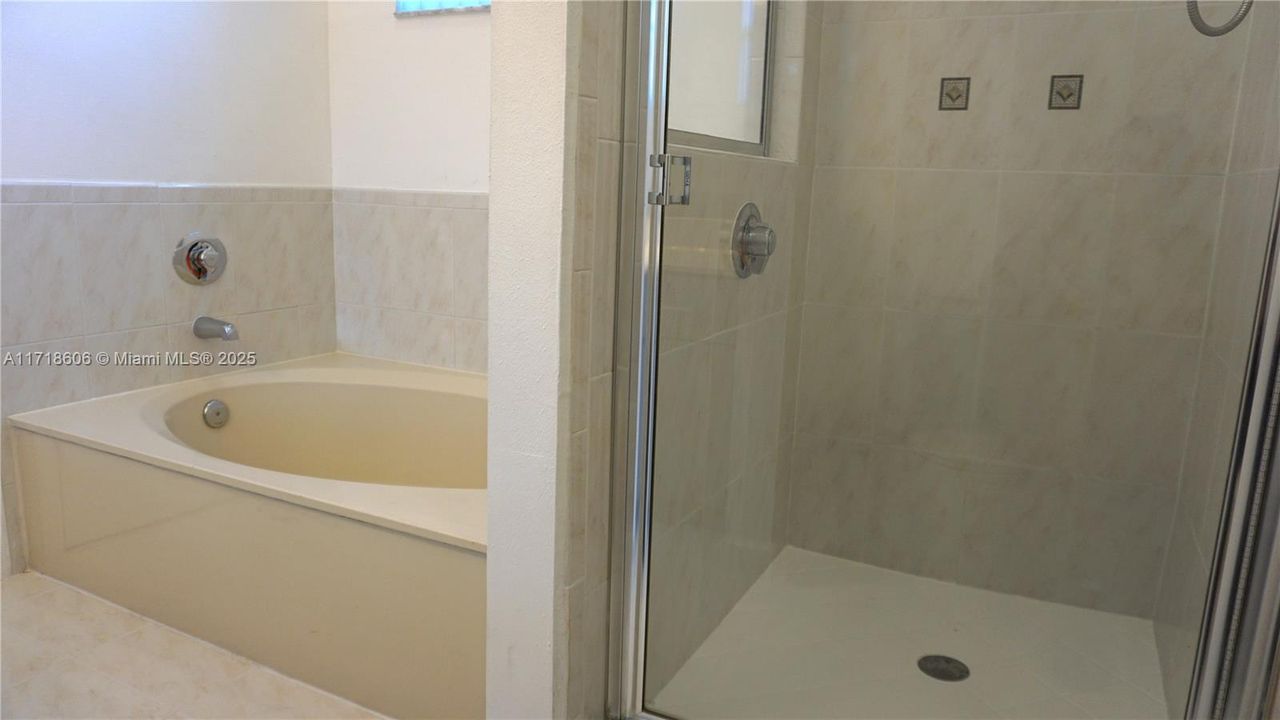 Bath tub and Shower in Master Bathroom.