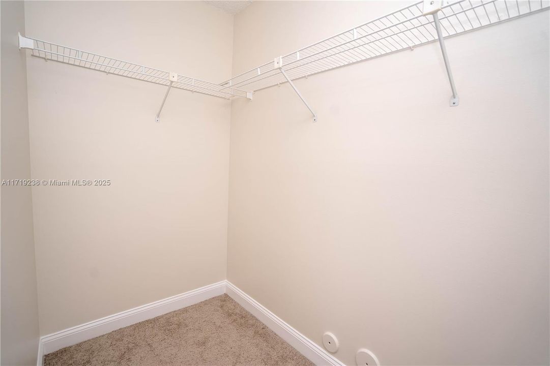 Walk-in closet in primary bedroom