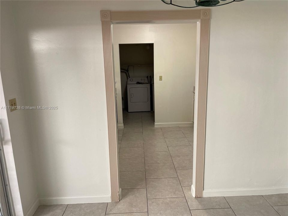 View from dining area into the kitchen/laundry room