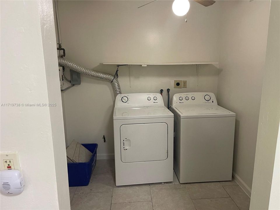 Laundry room with storage space