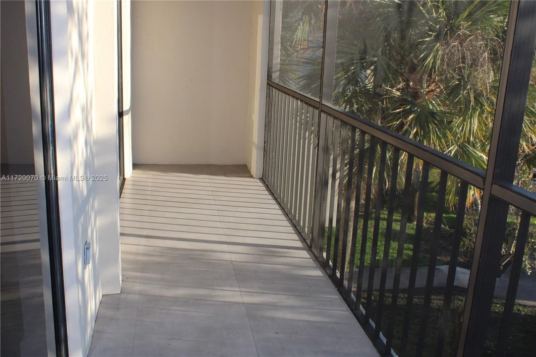 SCREENED BALCONY WITH STORAGE ROOM