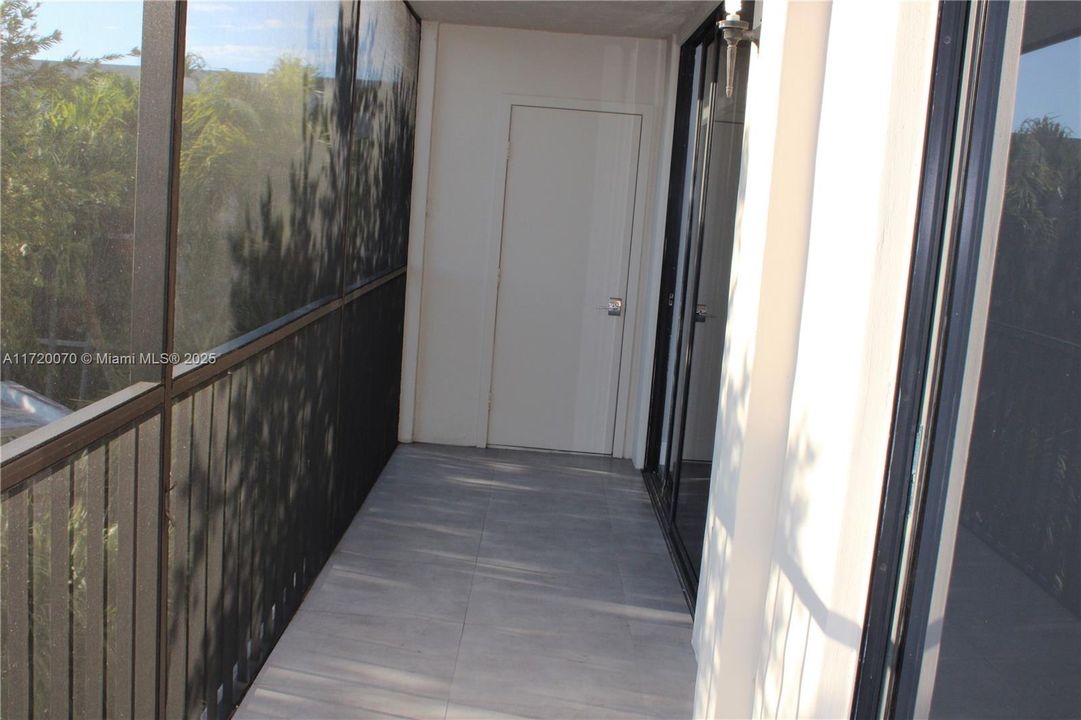 SCREENED BALCONY WITH STORAGE ROOM