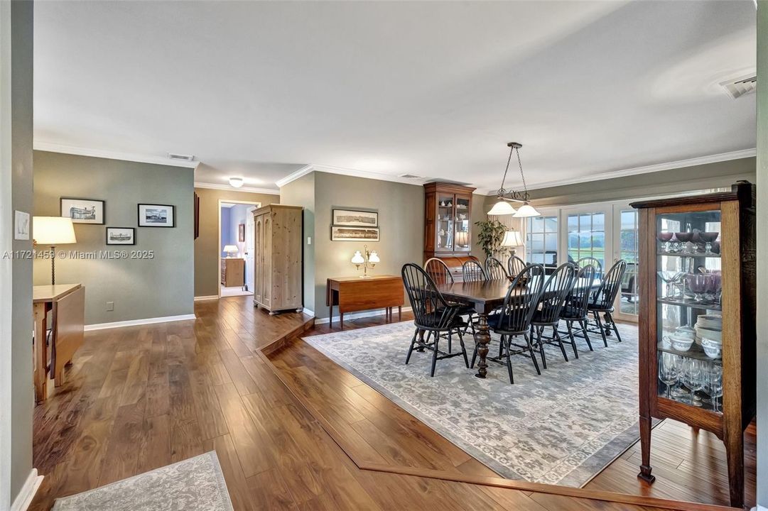 This area can be used as a dining or living area. Recently installed flooring