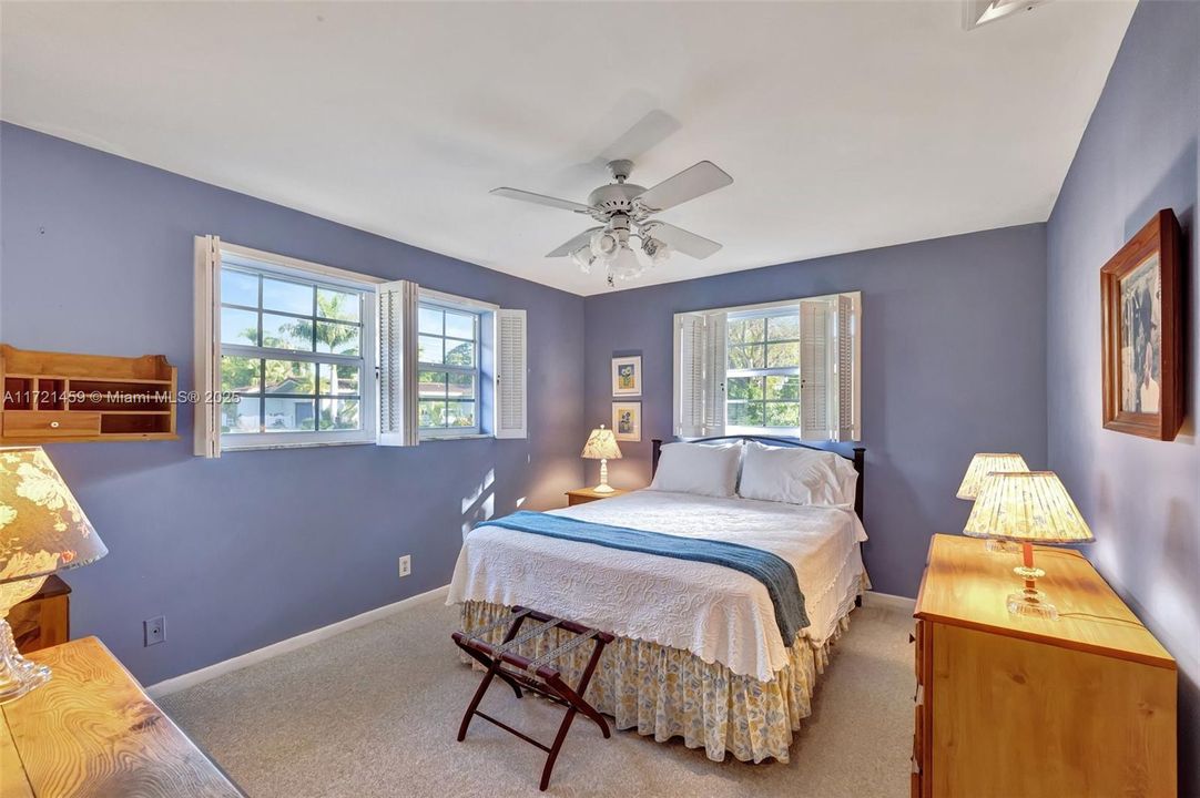 This bedroom overlooks the front of the home and has a large walk in closet