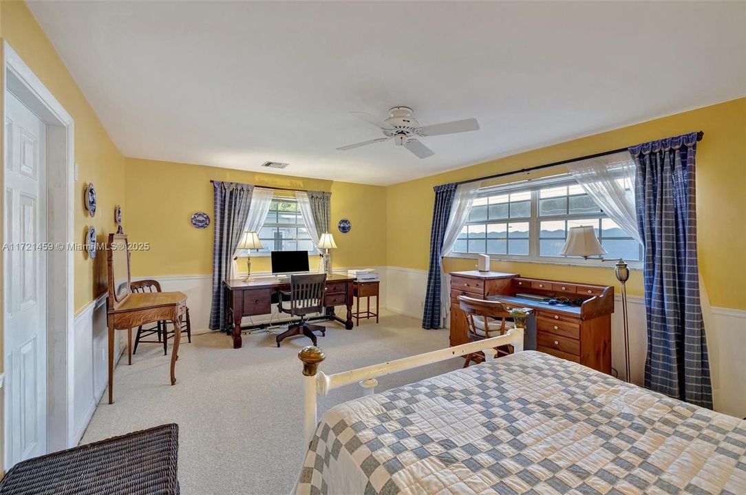 Large bedroom w/ space for office / sitting area. Two desks and vanity shown here.