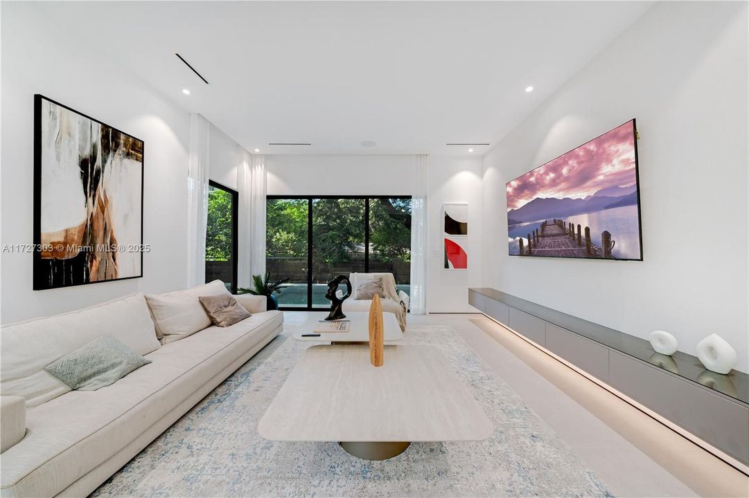 Fabulous Living room with access to the pool area via the sliding doors.