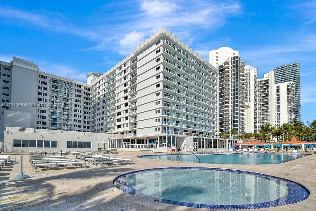 Luxury oceanfront condo in Sunny Isles Beach featuring resort-style pool with panoramic Atlantic Ocean views. Perfect beachfront lifestyle near Miami’s best dining and shopping.