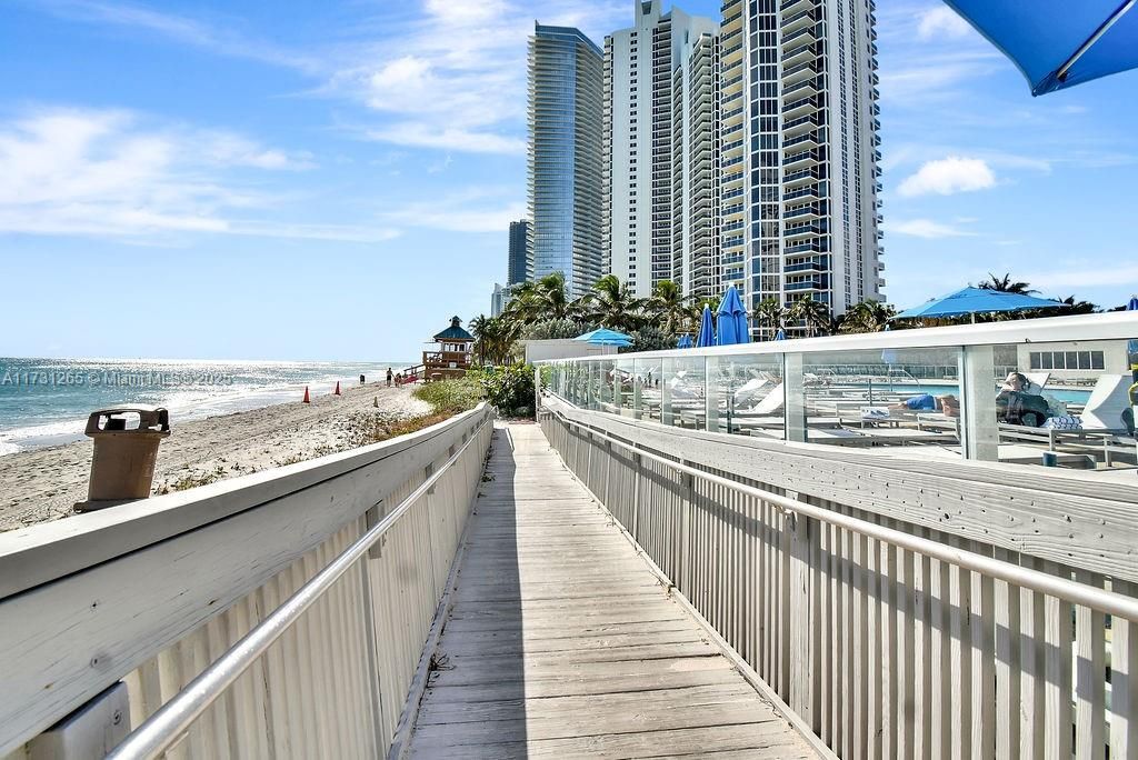 Private dock and boardwalk access offering direct connection to the beach and marina. Enjoy boating and waterfront leisure.