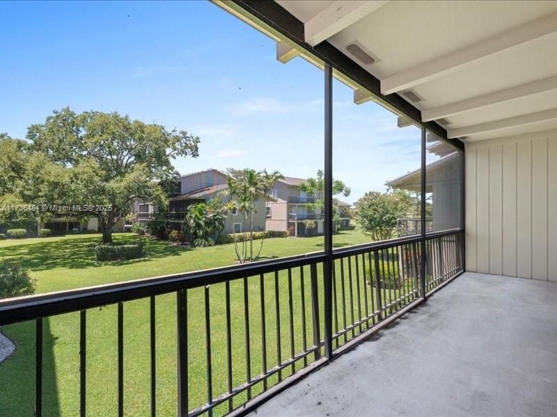 Private screened balcony off the Master with golf course views
