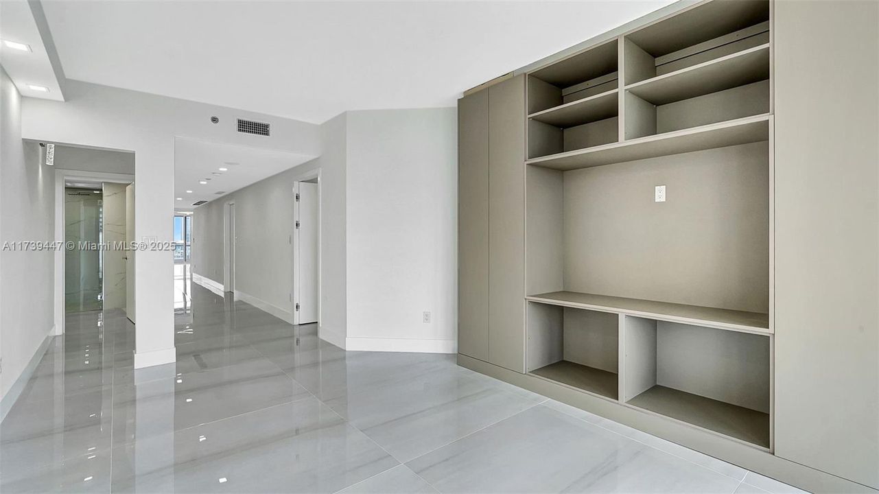 bedroom/den with built-in