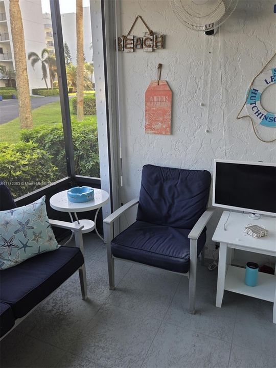 SCREENED PATIO WITH STORM PROTECTION