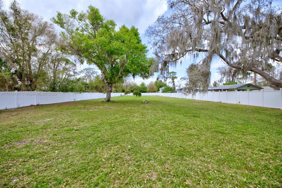 400 ft deep with tropical fruits, well sprinklers, access to back road