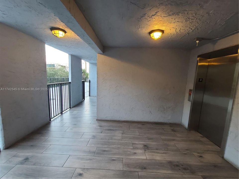 Elevator Landing on Amenity floor 3, with Pool & Hobby / exercise room