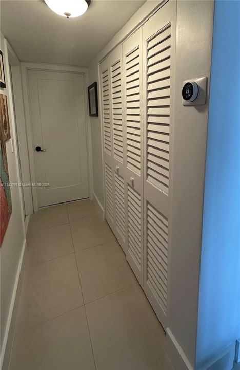 hallway to bedrooms with closet space