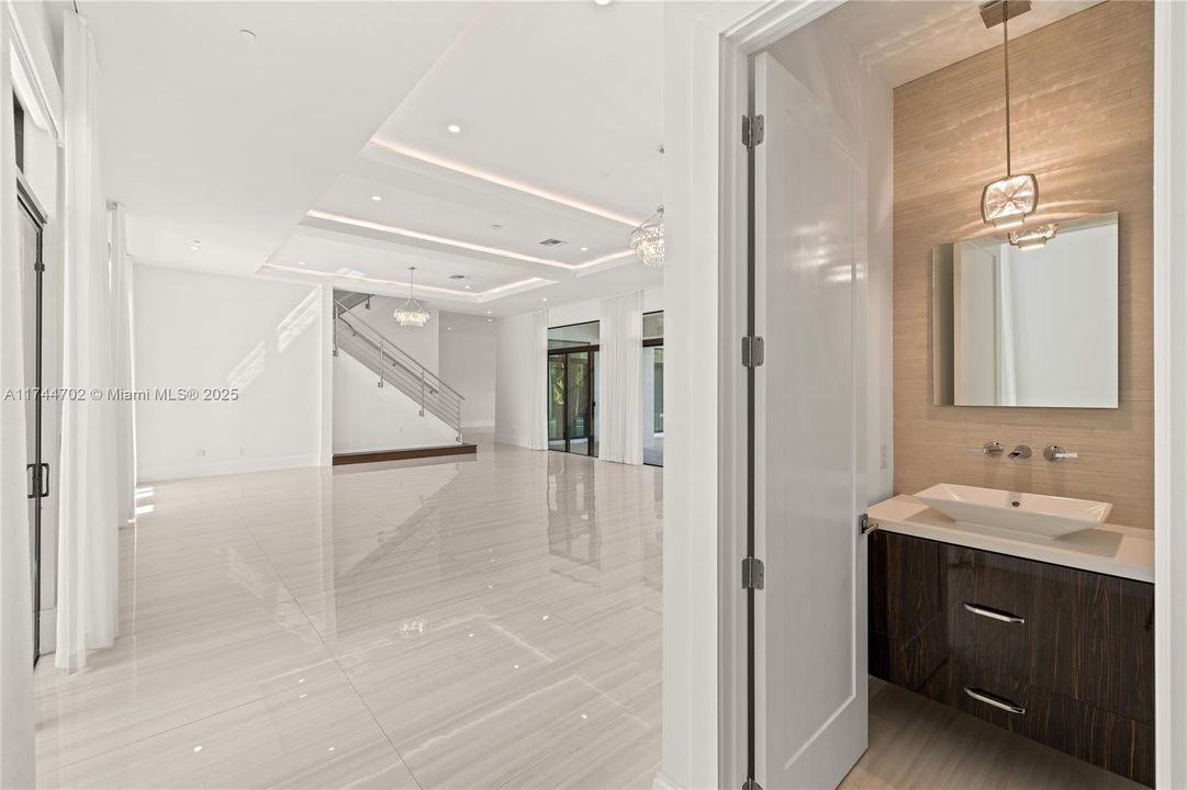 Powder room  off formal living room for guests.