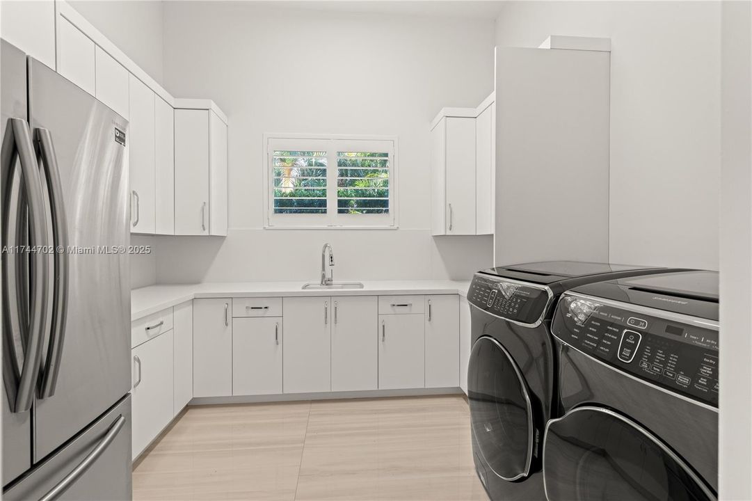 Walk-in HUGE laundry room next to kitchen
