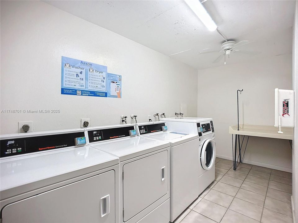 Laundry room just outside of condo. There is a laundry room on every floor.