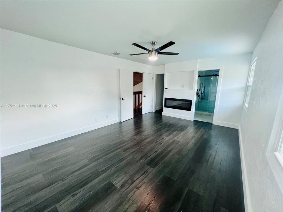Master Bedroom with Decorative Fireplace
