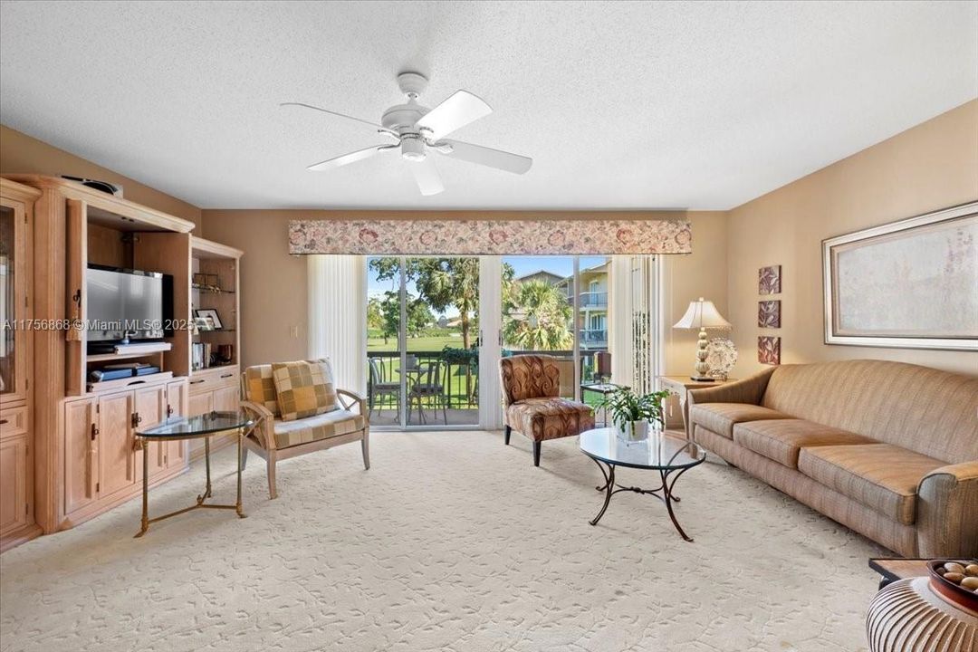 Spacious Living area with private balcony over looking greens and fairways . Wonderful eastern exposure and breezes