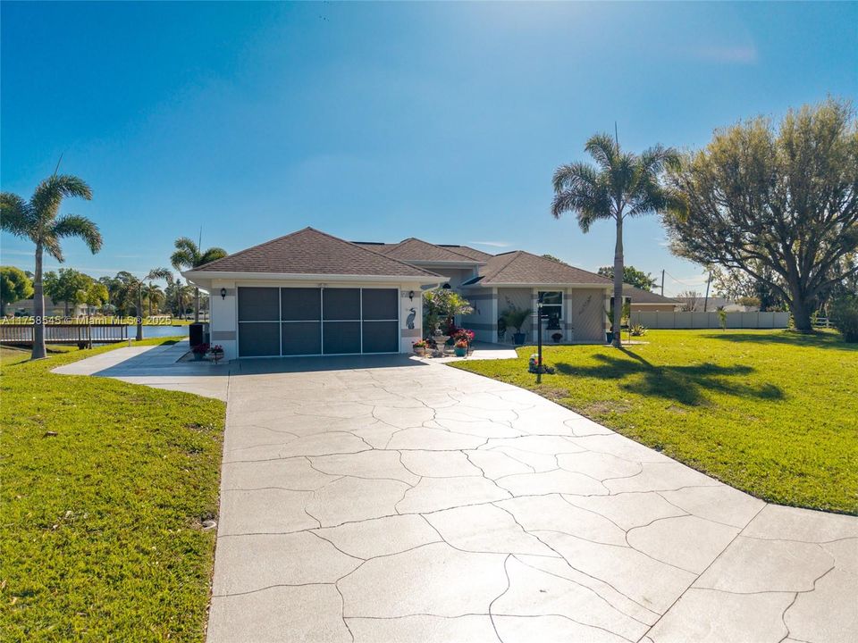 Driveway cement resurfaced to accommodate a boat on the side of the property.