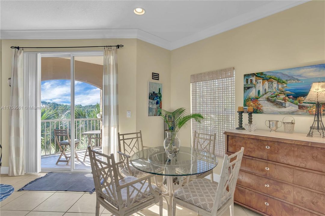 Breakfast nook overlooks the Grand Harbor Golf Course and balcony. A sunny, cheery spot to start and end your day.