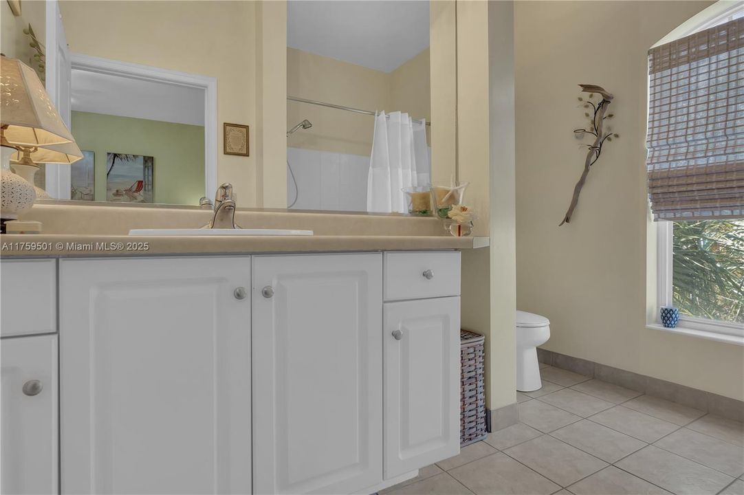 Master Bath Ensuite with window to the sunny outdoors.