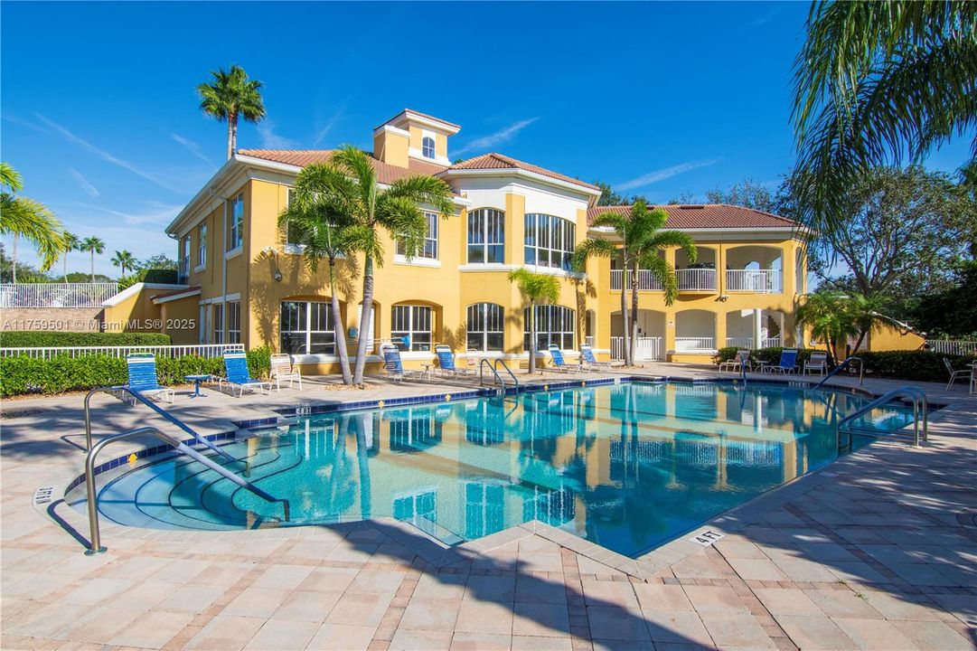 Community Clubhouse as seen from pool deck at the edge of the exclusive Grand Harbor golf course.