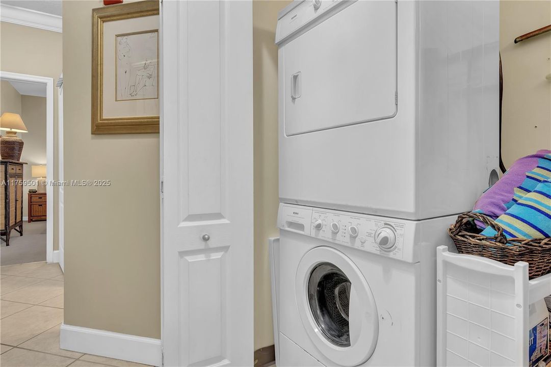 Inside laundry with full-sized washer and dryer.