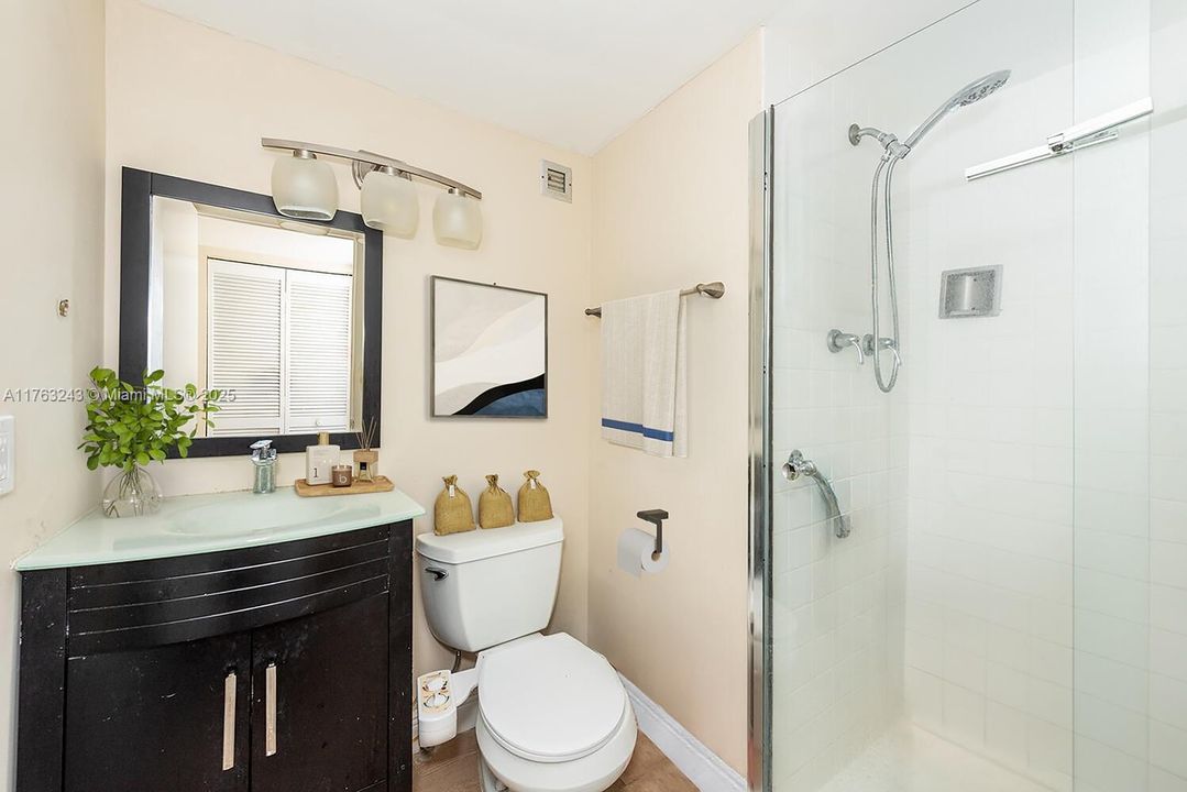 Virtually staged. 2nd bathroom.