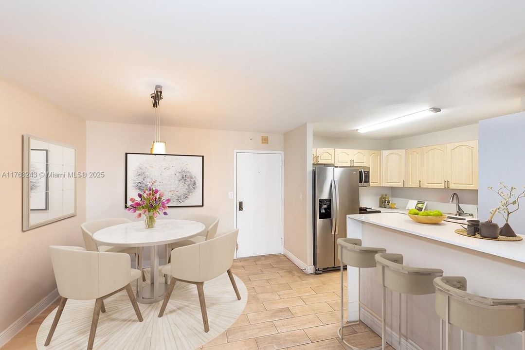 Virtually staged.  Dining area next to the kitchen.