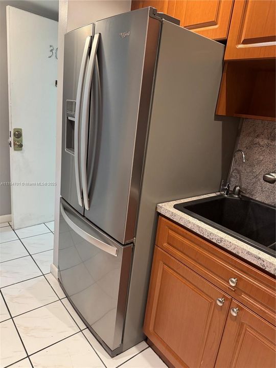 Brand new Stainless still Whirlpool Refrigerator