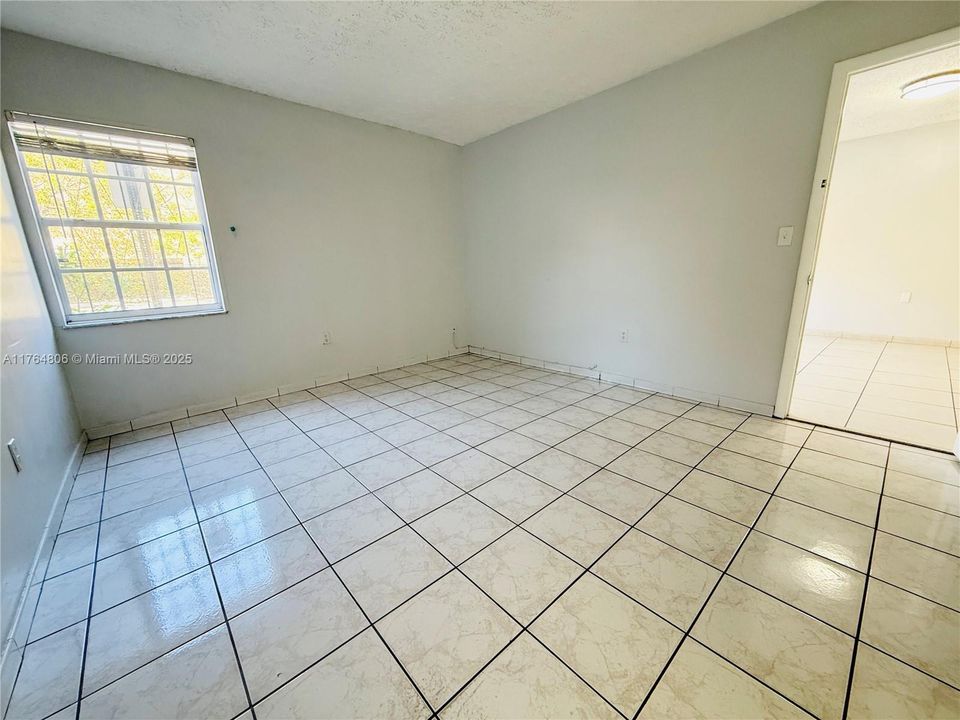 Primary Bedroom with Walk-In Closet and Half Bathroom