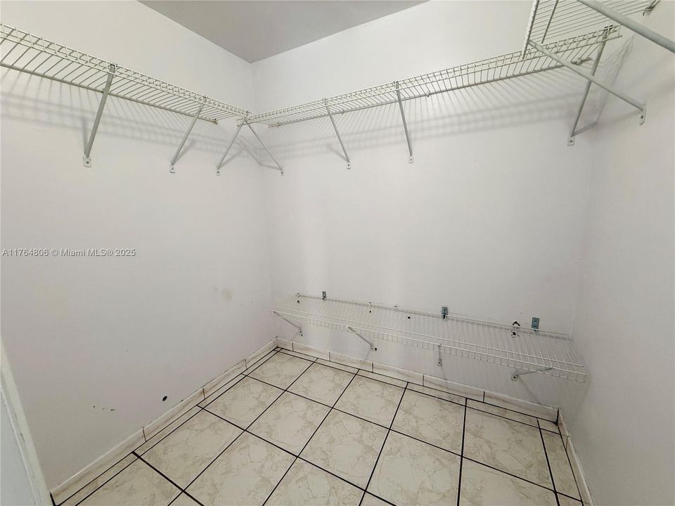 Walk-In Closet in Primary Bedroom