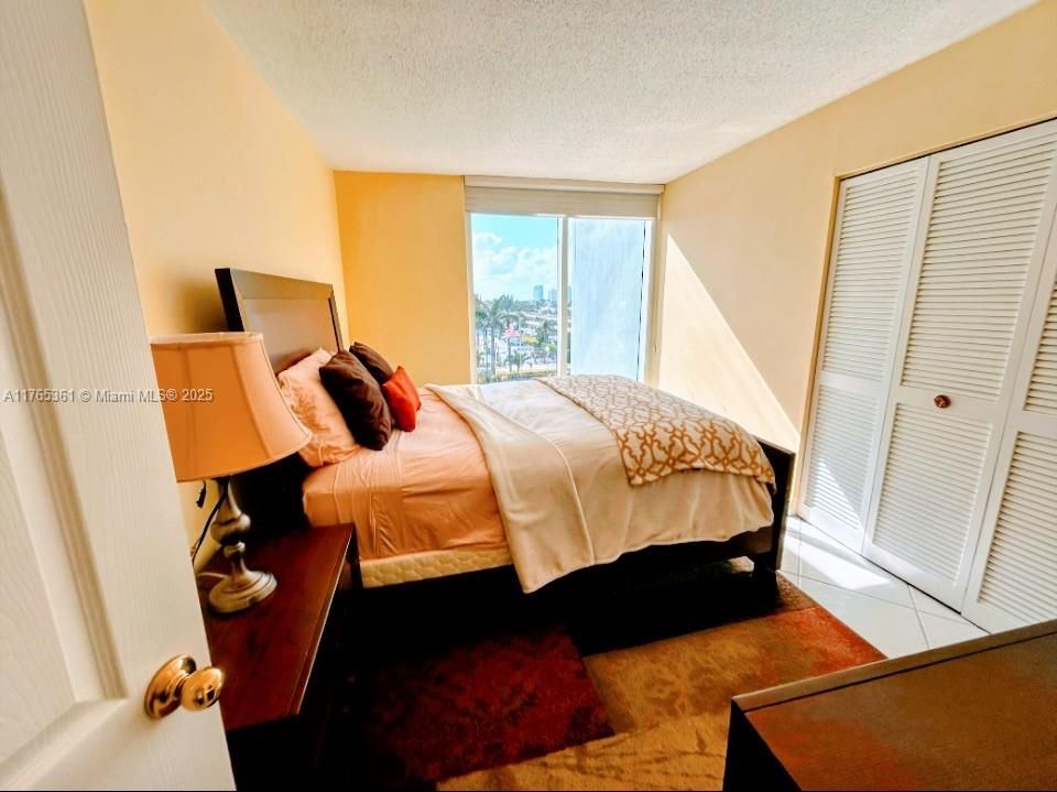 THIRD BEDROOM WITH  FLOOR TO CEILING MODERN GLASS VIEWS AND SPACIOUS WALK IN CLOSET