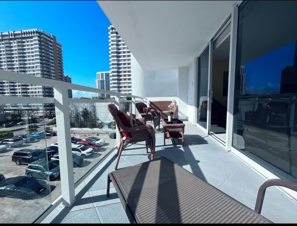 SPACIOUS PLUS SIZED OPEN AIR NEW GLASS TERRACE WITH OCEAN DRIVE LOCATION VIEWS (HURRICANE GLASS SLIDING DOORS)