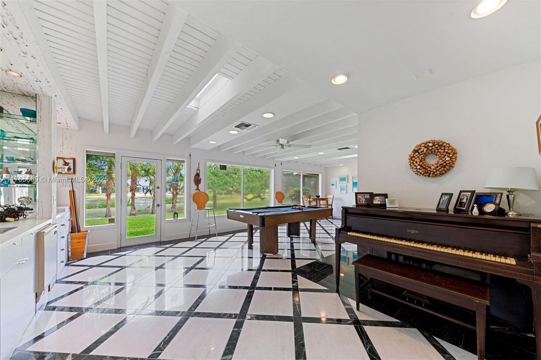 Enclosed and enlarges patio area with doors and windows allowing sunshine and great golf course views