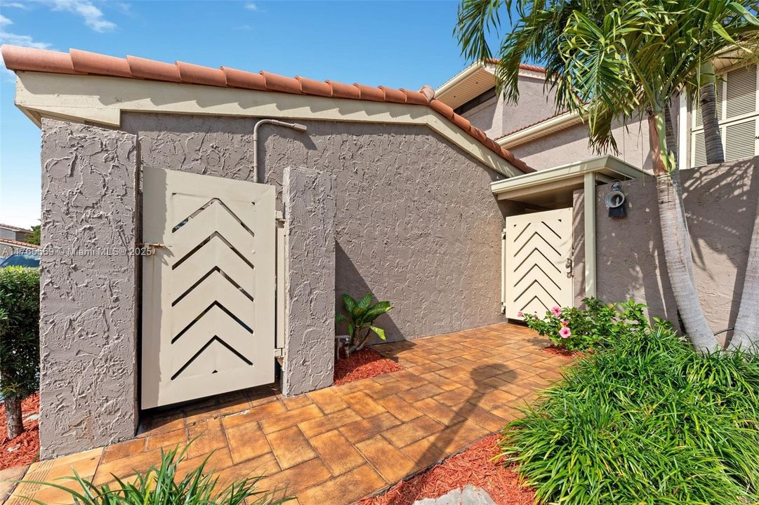 Front entrance with modernized gate and dorrs