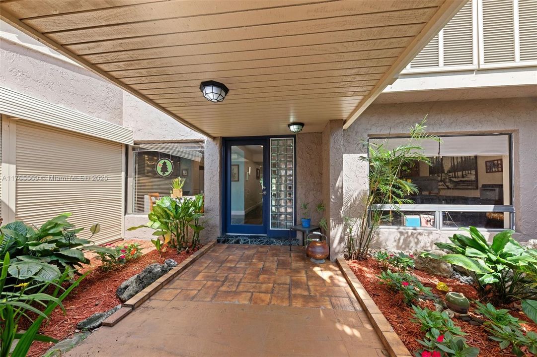 Entrance into beautifully landscaped area