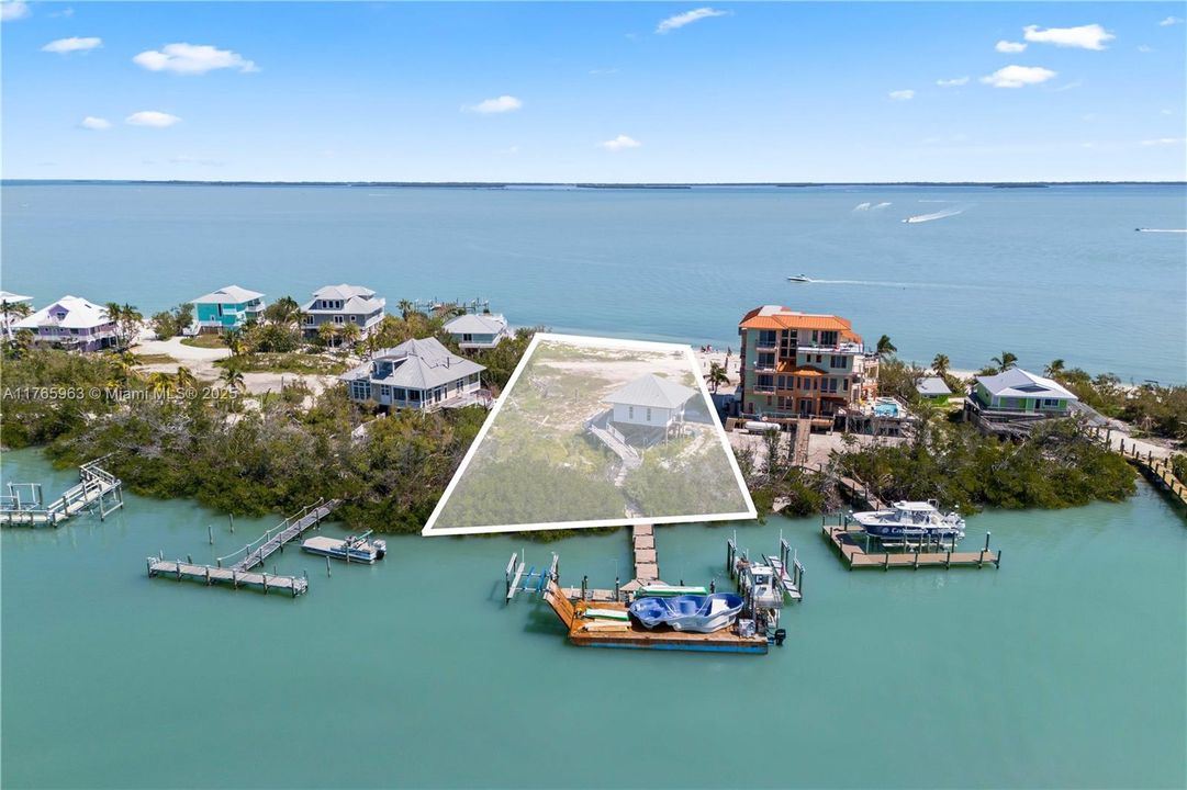 Small guest home remains and is sold as-is. This is a rare property offering Bay to Gulf access with deep waters and multiple boat lifts!