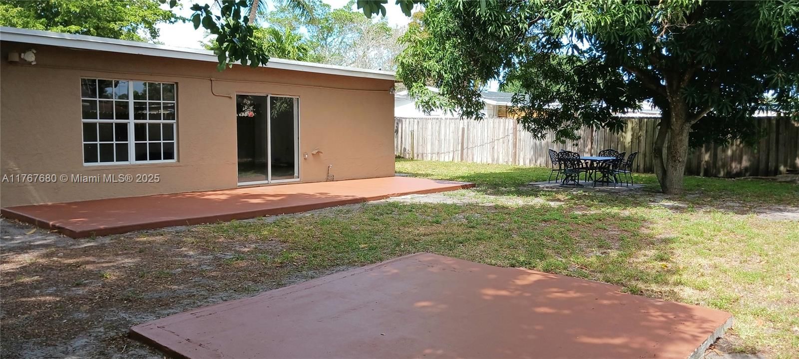 Fenced yard with shaddy fruit trees and room for pool