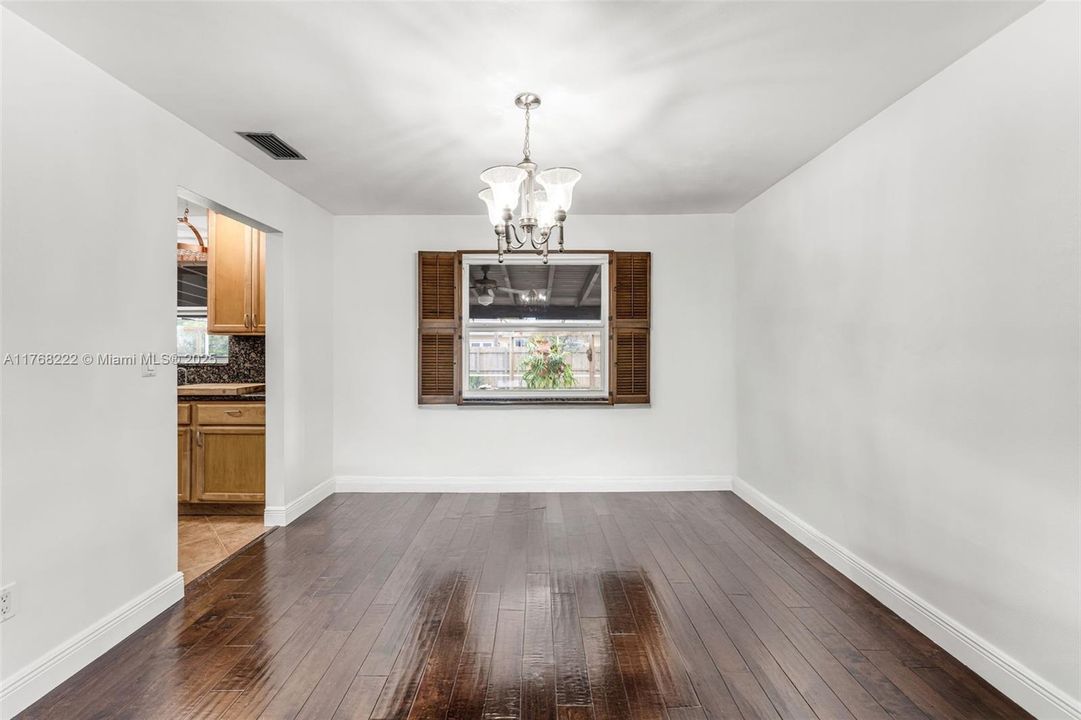 DINING ROOM LOOKS OUT ONTO THE PEACEFUL PATIO AREA!