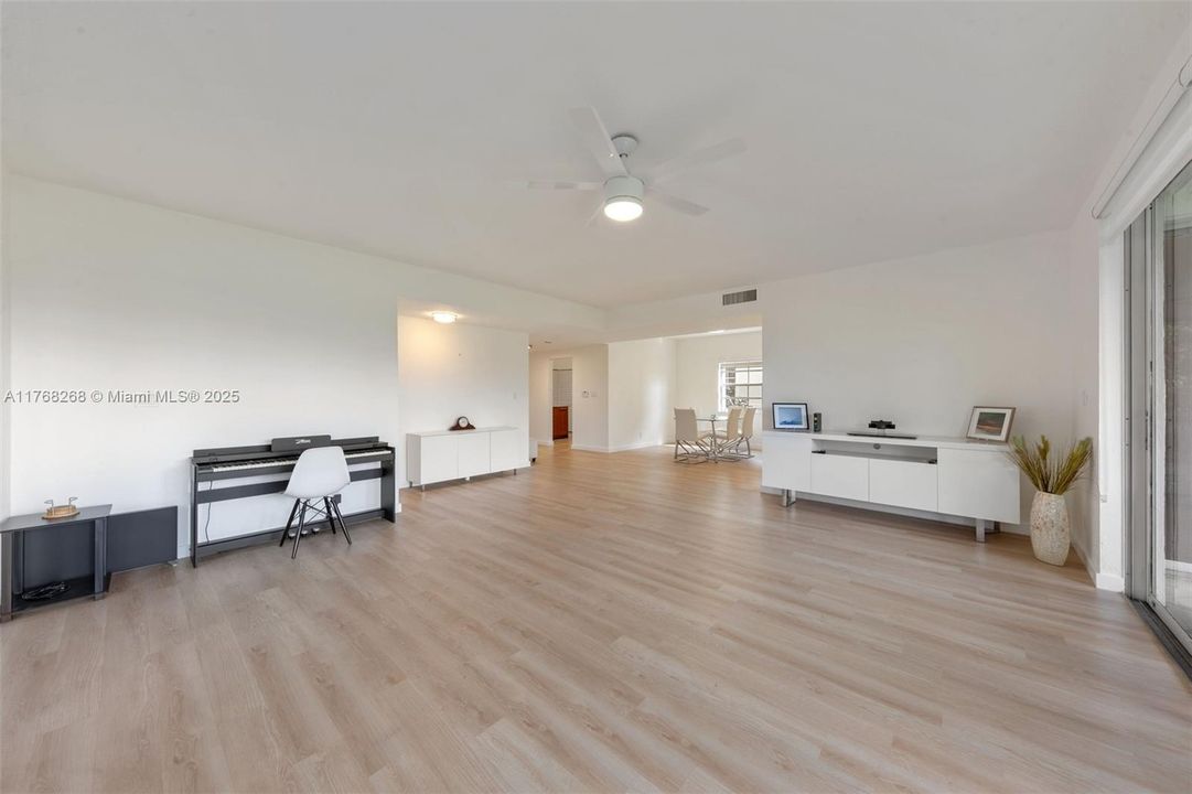 VIEW OF LIVING ROOM AND DINING ROOM.  SHOWS HUGE VIEW OF LIVING SPACE