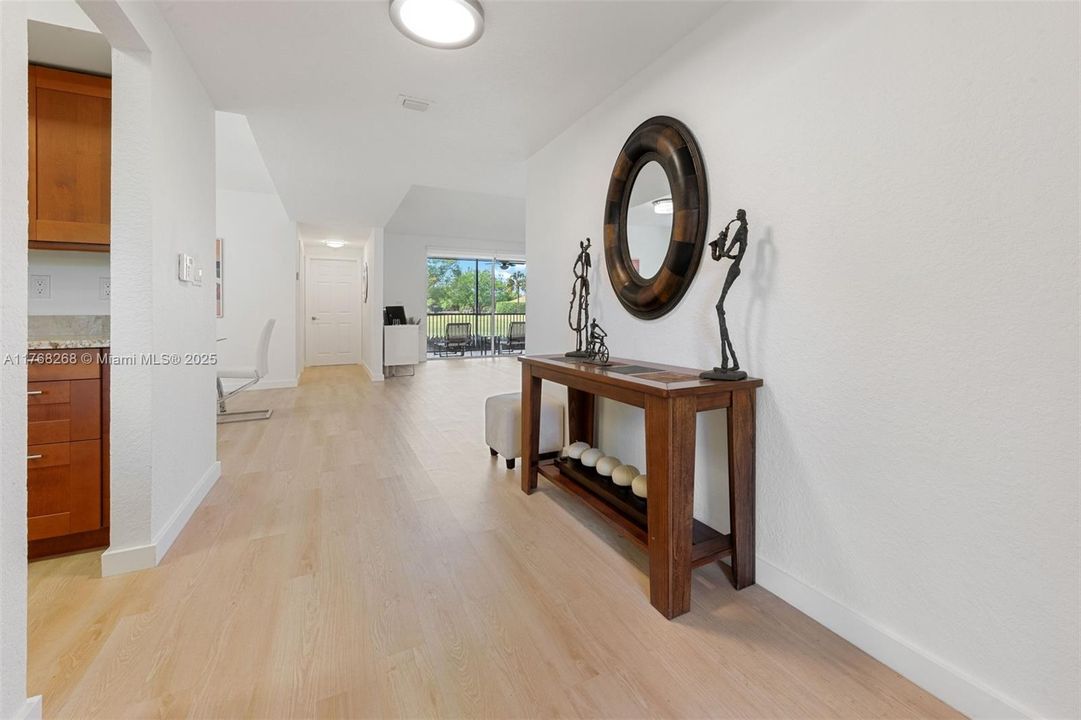 VIEW FROM FOYER INTO LIVING ROOM
