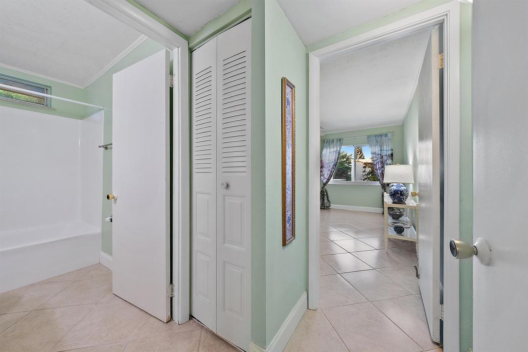 Hallway to guest bathroom and bedroom