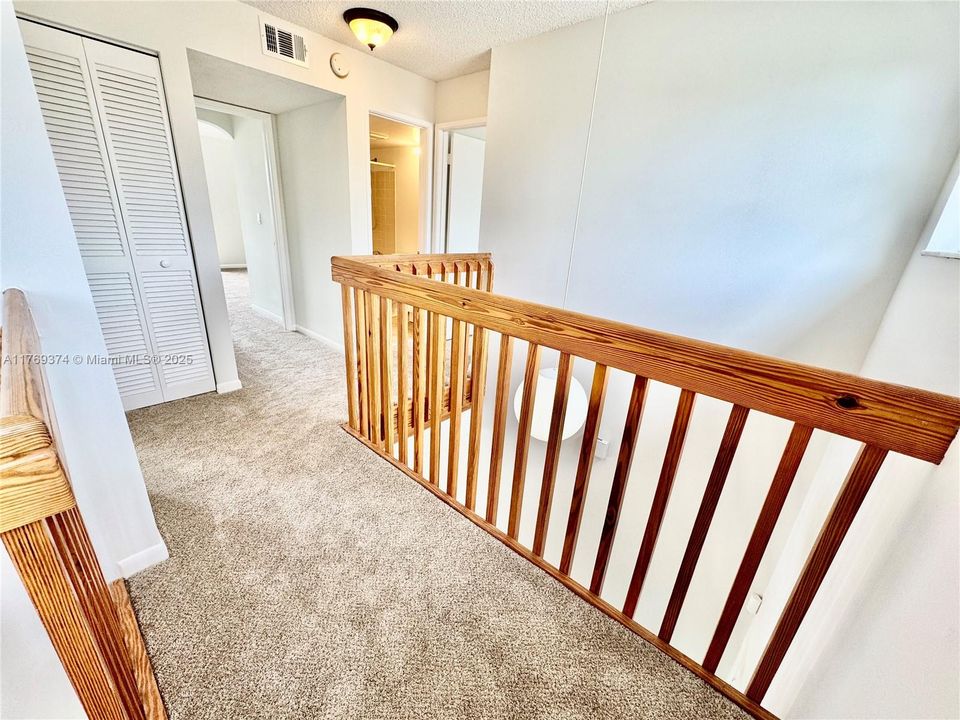 The stairs lead to the 3 upstairs bedrooms and a hall bathroom.