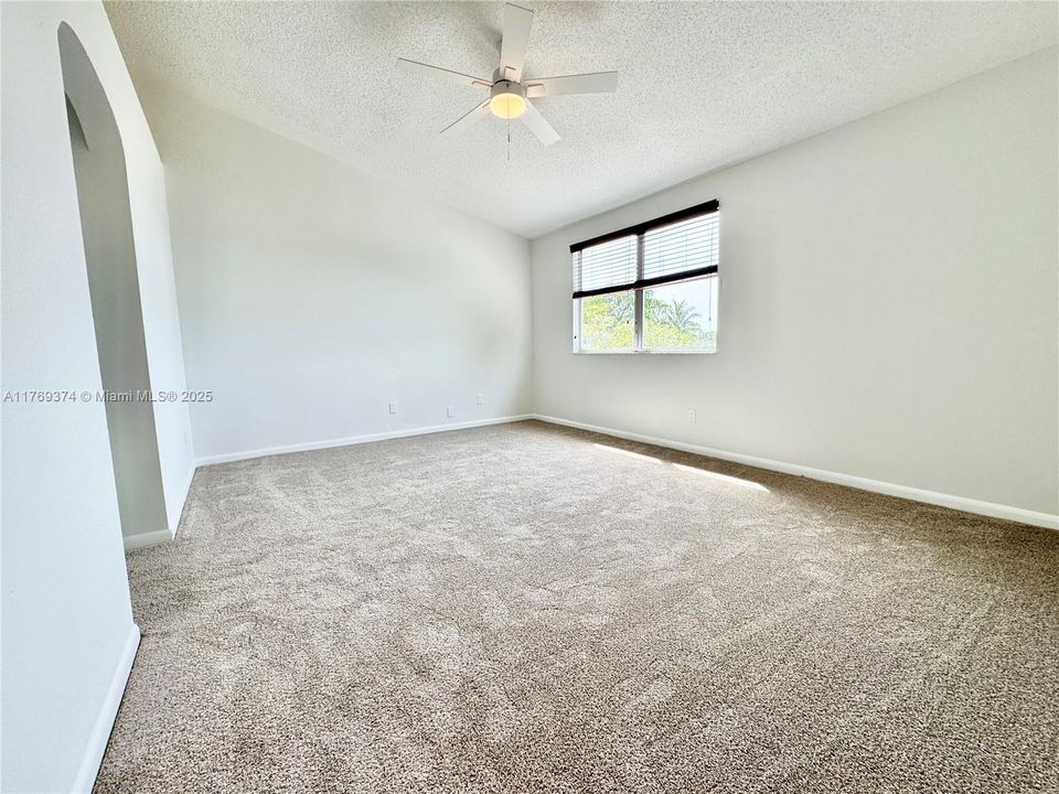 The spacious primary bedroom has it's own walk-in closet and in-suite bathroom with walk-in shower.