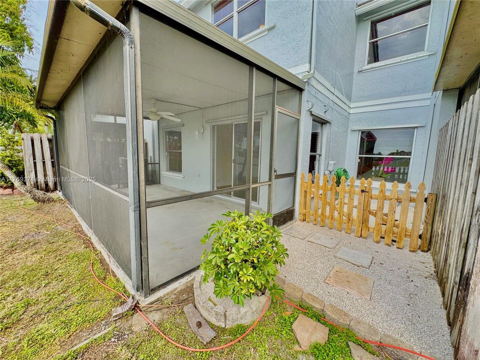 Small fenced in space to allow your small dog some outdoor time next to the screened in patio.